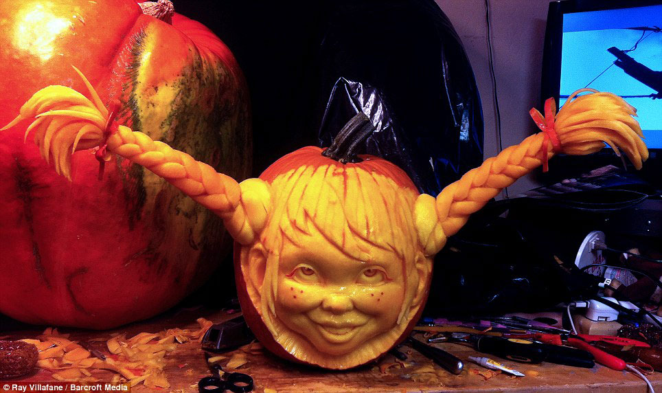 A work in progress: The pumpkins like this Pippi Longstocking creation take hours to carve using spoons and scalpels 
