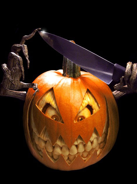Scary: This frightening pumpkin holding a knife would give anyone nightmares 